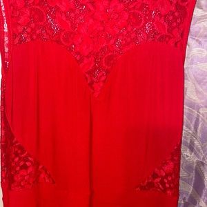 Red heart shaped at the top. Long Maxi dress with slit by the leg.